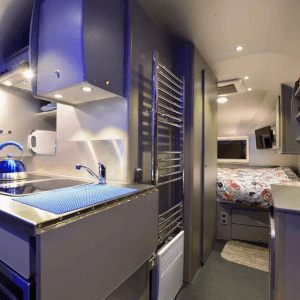 Interior of airstream style touring caravan aluminium glamping pod
